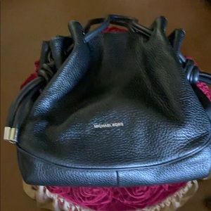 Black pebbled leather handbag.
